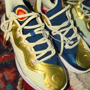 Under Armour Gold and Blue Curry basketball shoes